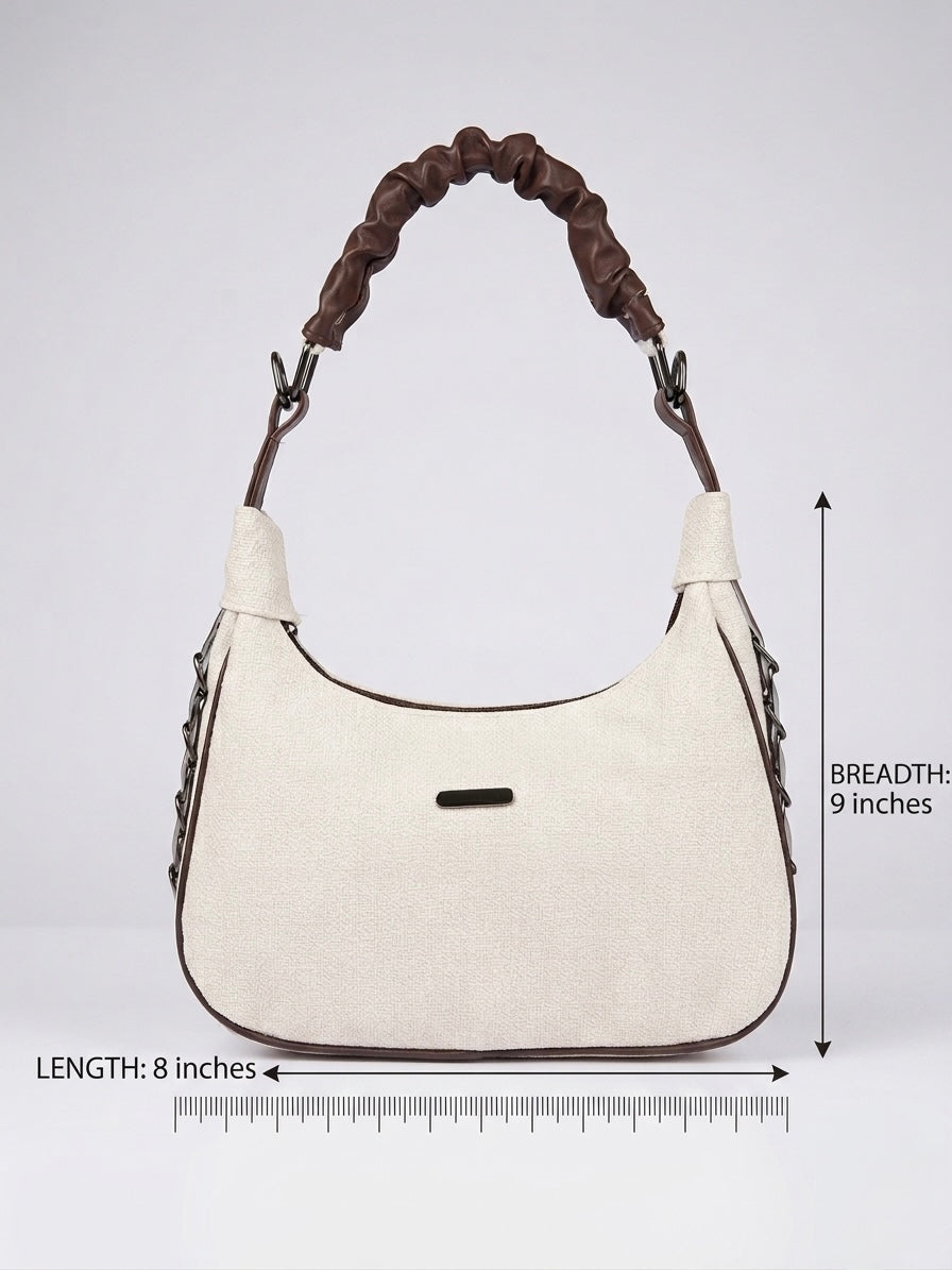 White handbag with brown handle and measurements on a light gray background