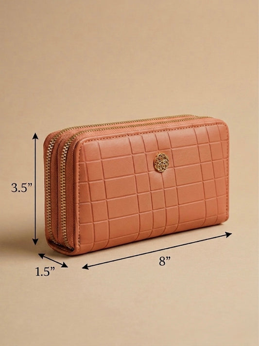 Pink quilted wallet with dimensions on a beige background
