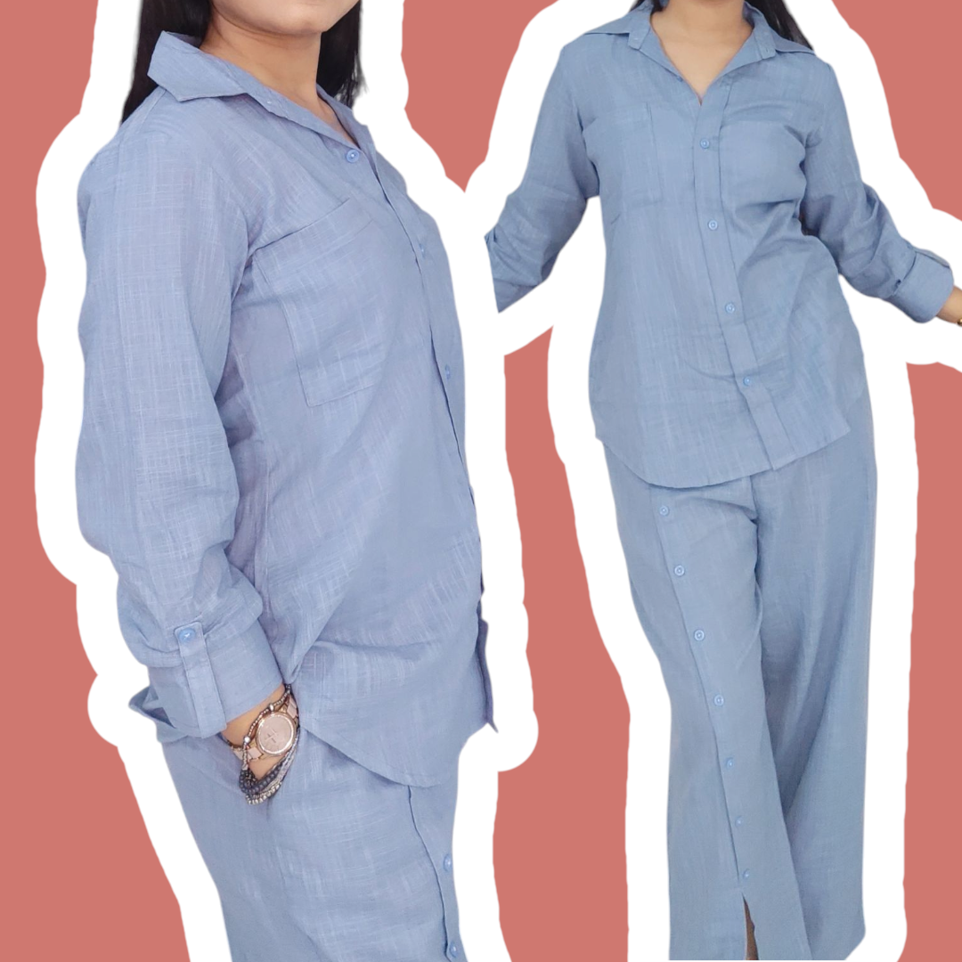 Light blue shirt and pants set on a plain background