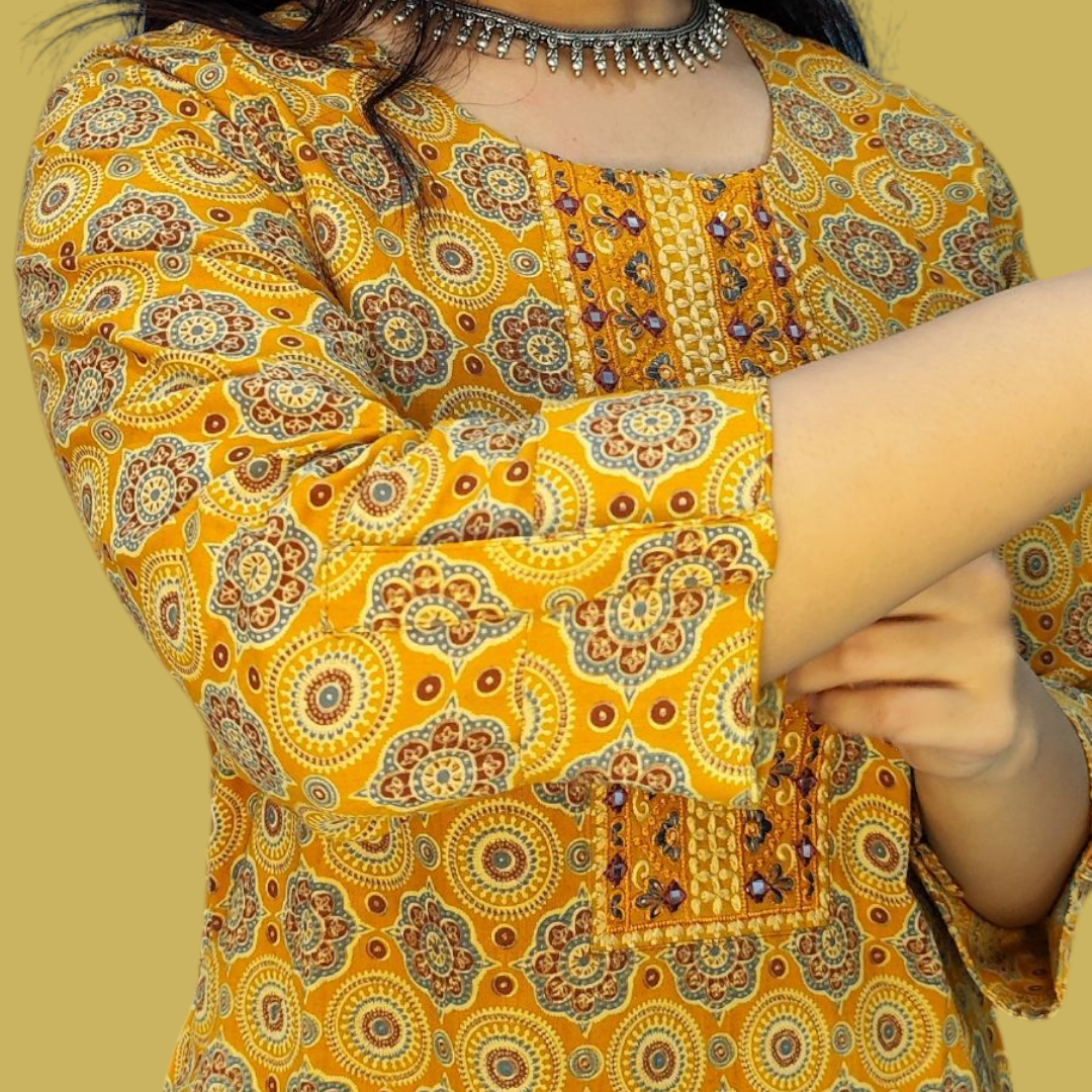 Yellow patterned dress with intricate design on a yellow background
